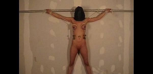  Hooded amateur bdsm and big tit whipping of Danii in bondage and dungeon punishm